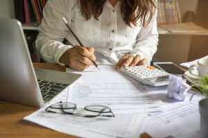 woman looking at tax refund and debt
