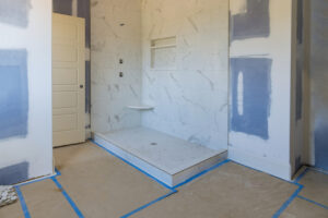 Renovation construction of master bathroom with new under construction bathroom interior drywall ready for tile