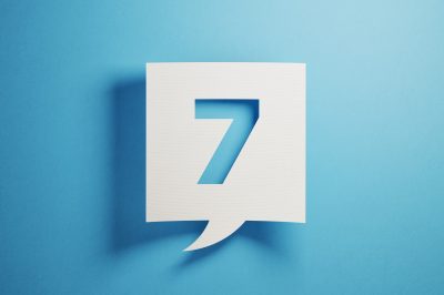"7" on paper with blue background