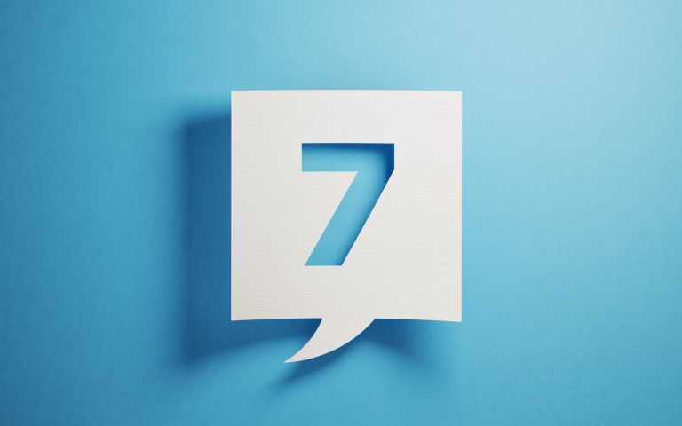 "7" on paper with blue background