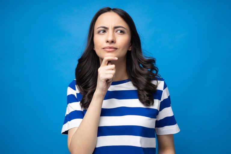 Portrait of young woman wear trendy smart casual outfit isolated on blue background