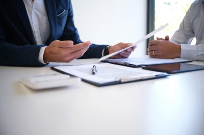 Lawyer talking with client about debt