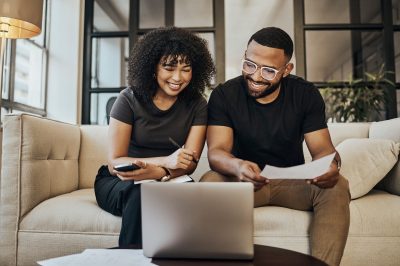 Planning, finance and couple with paper and laptop for budget, insurance and savings