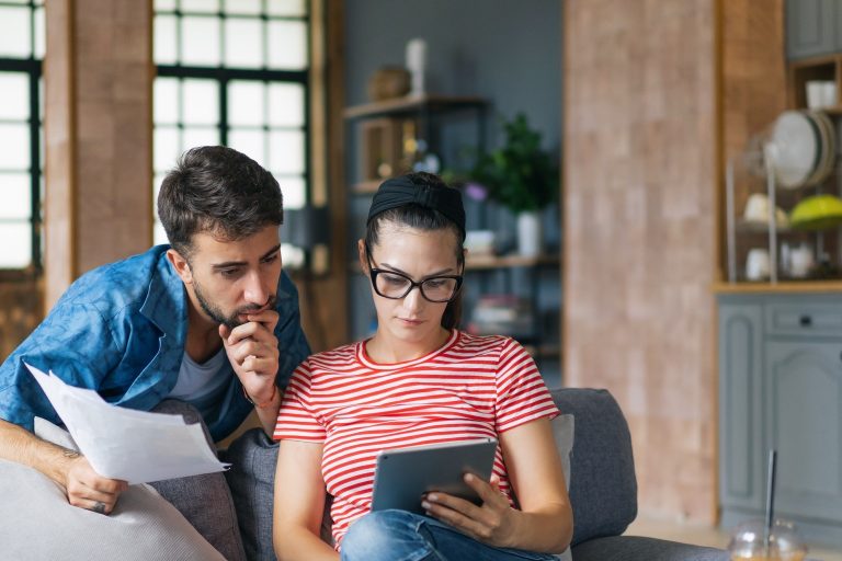 Couple looking at credit score after debt consolidation