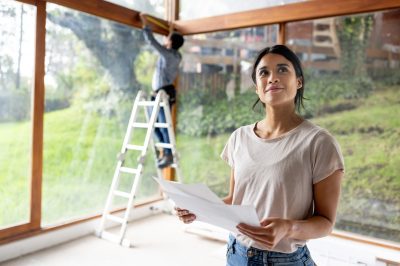 Woman renovating house with money from home equity