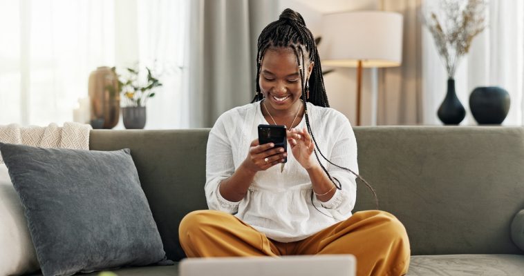 Woman on phone looking at cash advance app