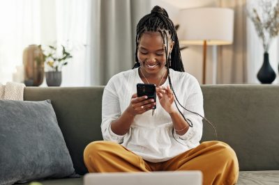 Woman on phone looking at cash advance app