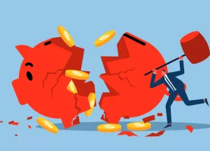 man breaking piggy bank