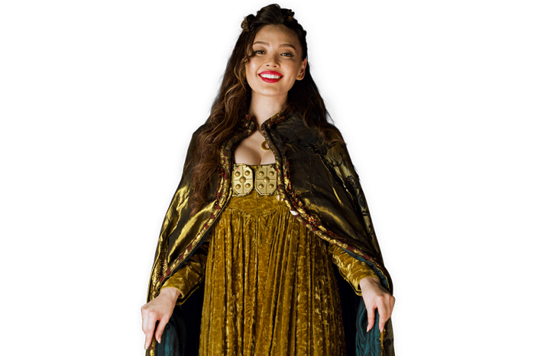 Viking Ingrid smiling and wearing a dress and long cape