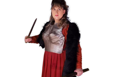 Viking Kindra holding a dagger and wearing a silver breastplate over her dress