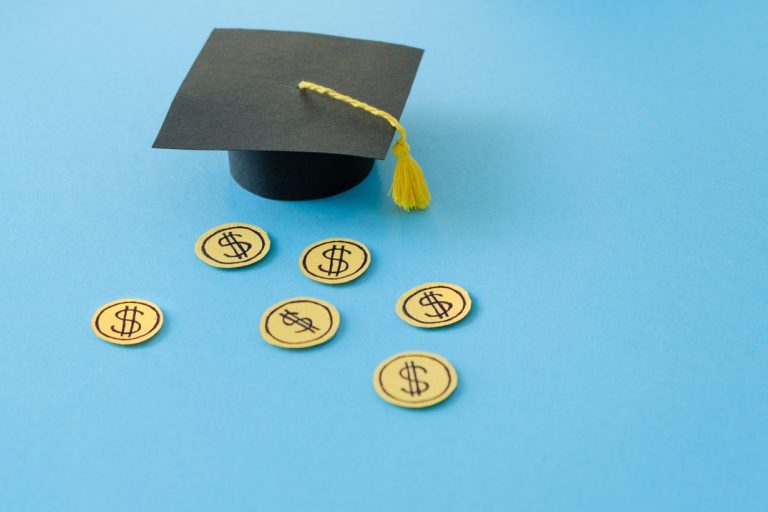 Graduation cap and dollar signs as symbol of education investment. Concept Education Costs