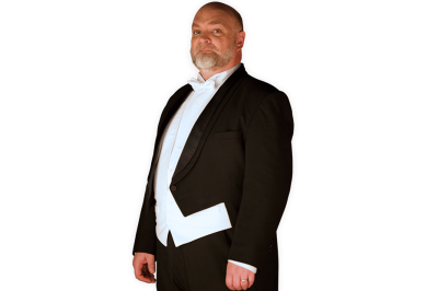 The Conductor wearing a full tuxedo with coattails