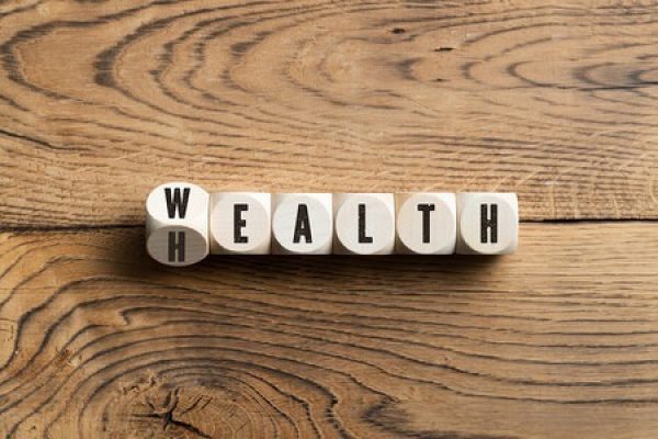 Game pieces that spell out a hybrid of "wealth" and "health"