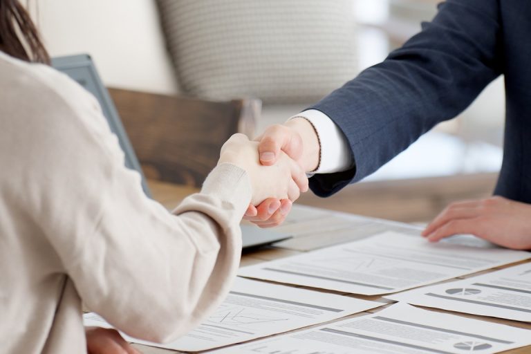 Shaking of hands after agreeing to settlement terms
