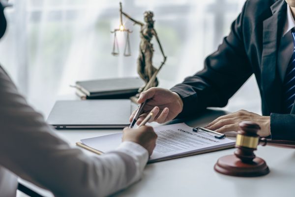 Lawyers talking over a case and deciding if pre settlement funding makes sense for their client