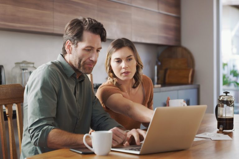 Couple working through their debt management plan (DMP)